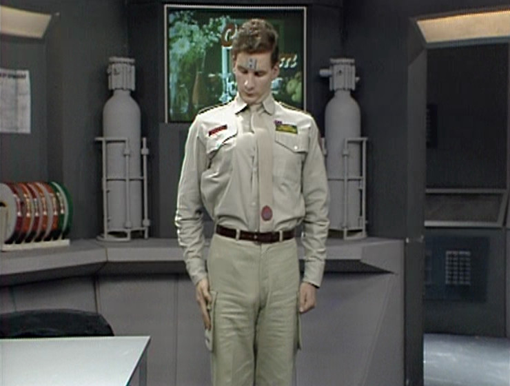 Rimmer staring at his own tit in the exam room