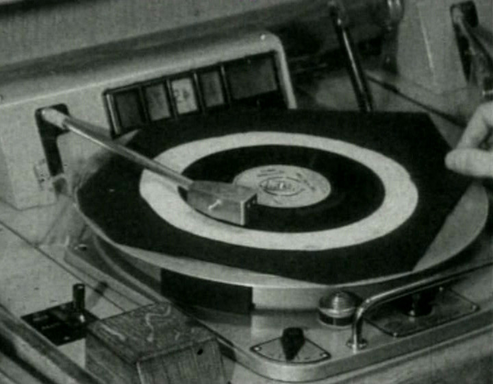 A turntable spinning, flipped