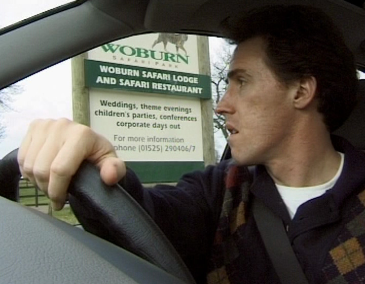 Keith next to a Woburn Safari Park sign