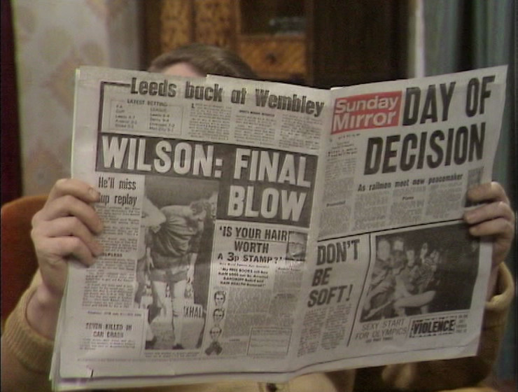 A paper being held by Eddie - the Sunday Mirror. Main headline: Day of Decision