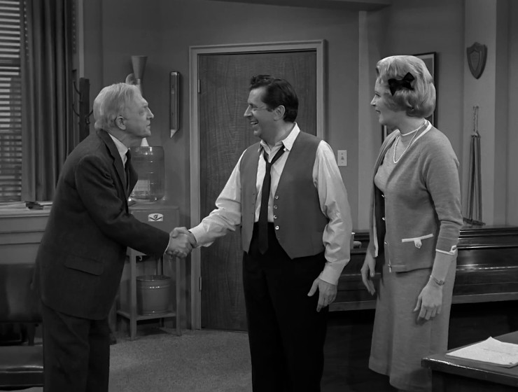 Henry shaking hands with Buddy and Sally