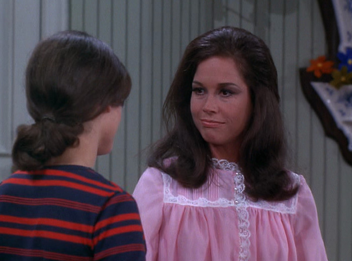Mary and Rhoda, with flowers on the wall